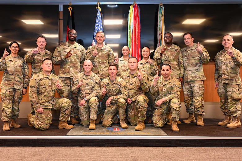 U.S. Army Europe and Africa leadership pose for a group photo with the winners of the fiscal year 2025 Logistics Excellence Awards during a ceremony in Wiesbaden, Germany, June 12, 2026. The event honored the top logisticians, maintenance professionals, and environmental stewards from across the theater for their contributions to Army readiness. Pictured are (back row, from left) Command Sgt. Maj. Malave; Command Sgt. Maj. Mullinax; Staff Sgt. Walton; Capt. Cavin; Spc. Ista; Spc. Bautista; Staff Sgt. Granger; Gen. Christopher Donahue, commanding general of U.S. Army Europe and Africa; and Command Sgt. Maj. Giancarlo F. Lalor, USAREUR-AF senior enlisted leader. (Front row, from left) Staff Sgt. Jones; Capt. Abell; Staff Sgt. Timm; Sgt. Colon; and Staff Sgt. Whitfield. (U.S. Army photo by Mr. Nathaniel Petraitis)