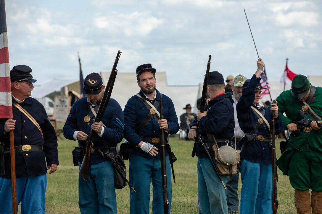 Civil War reenactors from Poland, reenact a battle scene during Freedom 250 at Poznan, Poland, July 3, Freedom 250 celebrates the enduring partnership between the United States and Poland through shared history, values and allied cooperation. Freedom 250 observances bring American and Polish communities together through partnership and cultural exchanges.  (U.S. Army Reserve Photo by Sgt. Shaun R. Rajasekar)