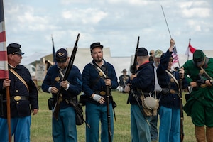 Civil War reenactors from Poland, reenact a battle scene during Freedom 250 at Poznan, Poland, July 3, Freedom 250 celebrates the enduring partnership between the United States and Poland through shared history, values and allied cooperation. Freedom 250 observances bring American and Polish communities together through partnership and cultural exchanges.  (U.S. Army Reserve Photo by Sgt. Shaun R. Rajasekar)