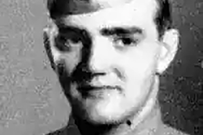 A soldier in uniform poses for a headshot.