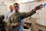 Maj. Pierre Matte, Joint Operations Center Battle Manager, updates Ken Flowers, National Guard Bureau chief information officer/J6’s chief tech officer and division chief, J65 National Guard Bureau and Ed Pruitt, Maven Systems on the National Guard support to Seattle’s FIFA World Cup 2026 matches, June 26, 2026, at the Joint Operations Center, Camp Murray, Washington. Photo by Joseph Siemandel.