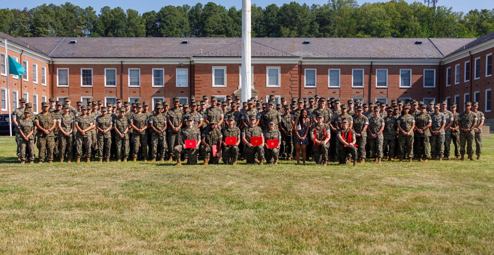 U.S. Marine Corps Sgt. Maj. Carlos A. Ruiz, the 20th sergeant major of the Marine Corps, poses for a group photo with Marines and leadership of Security Battalion, Marine Corps Base Quantico, during a promotion ceremony at Lejeune Hall on MCB Quantico, Virginia, July 1, 2026. Ruiz visited MCB Quantico and participated as the senior enlisted leader for a promotion ceremony. (U.S. Marine Corps photo by Lance Cpl. Lynsee Avila-Ramirez)