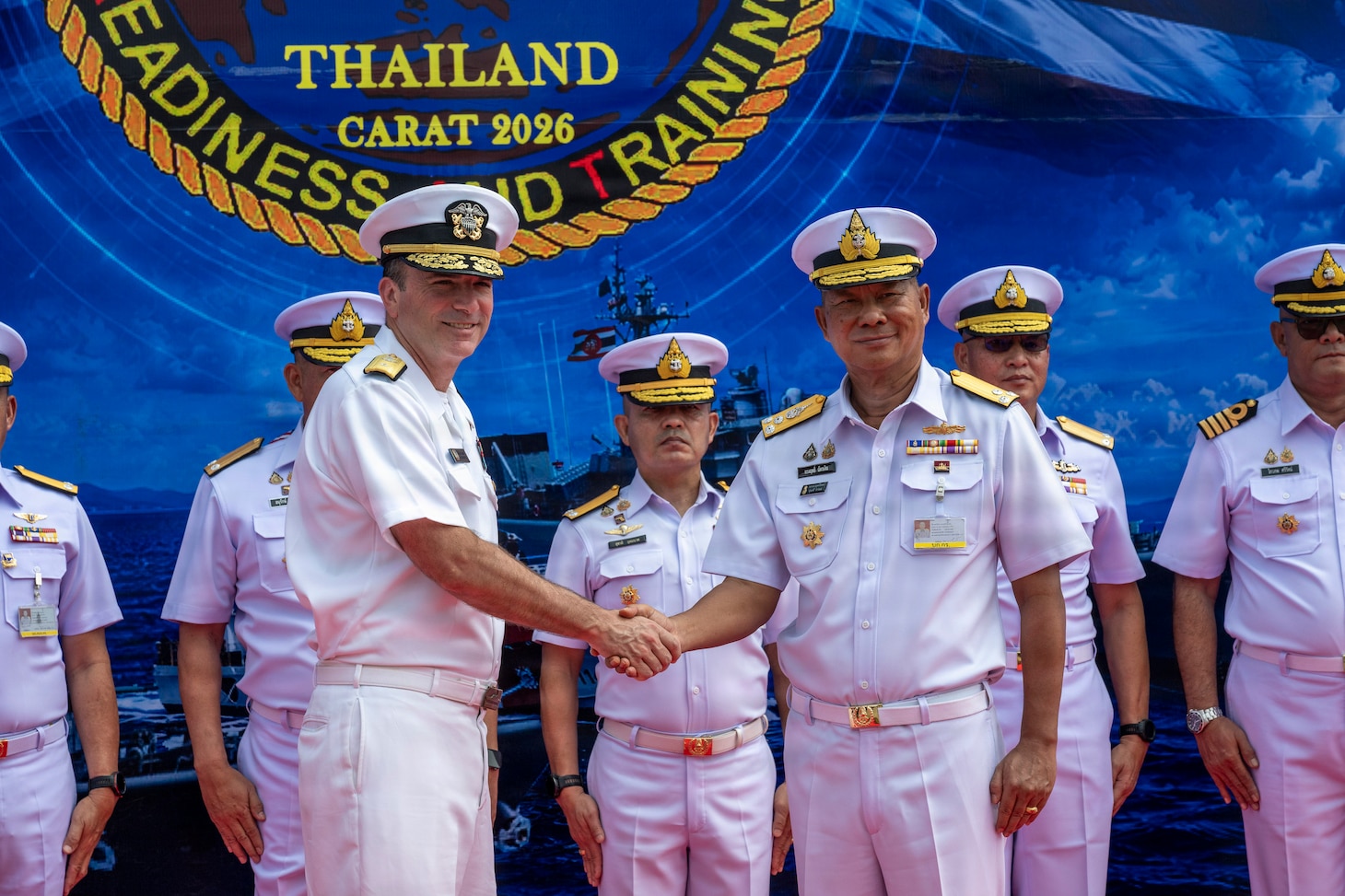 U.S. Navy Rear Adm. Kyle Gantt, deputy commander of U.S. 7th Fleet, shakes hands with Royal Thai Navy Vice Adm. Songkrit Chatngern, deputy commander in chief of the Royal Thai Fleet, during the opening ceremony of exercise Cooperation Afloat Readiness and Training (CARAT) Thailand 2026, July 6, 2026, at Laem Tian Pier.