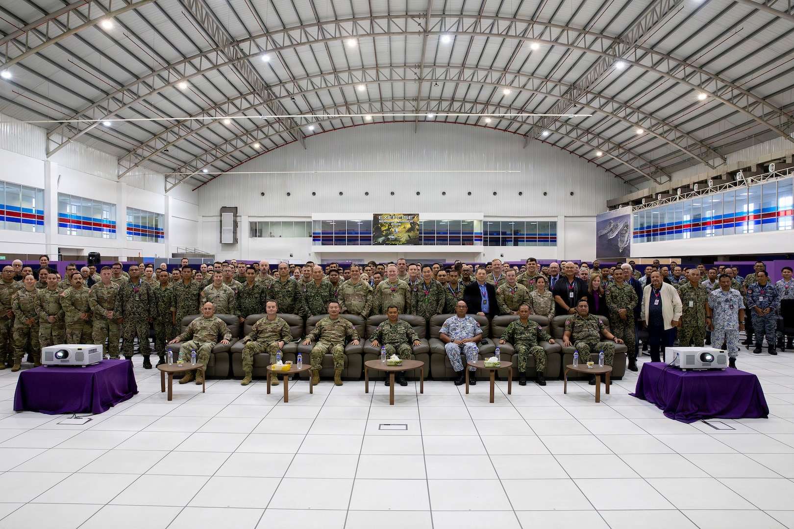 U.S. and Malaysian service members pose for a group photo during the closing ceremony for Bersama Warrior 26 at the Joint Warfighting Center, Kuantan, Malaysia, June 12, 2026.