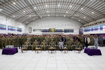 U.S. and Malaysian service members pose for a group photo during the closing ceremony for Bersama Warrior 26 at the Joint Warfighting Center, Kuantan, Malaysia, June 12, 2026.