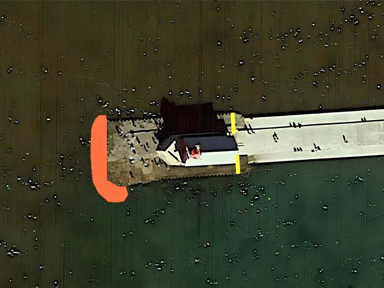 The U.S. Army Corps of Engineers, Detroit District will install armor stone for structural stabilization at the end of the Grand Haven south pierhead between July 9-13, requiring temporary closures near the lighthouse. The project area is marked in red, where loose sheet pile will be reinforced, while the yellow lines mark the construction barriers that will be temporarily installed. (U.S. Army Corps of Engineers graphic illustration.)