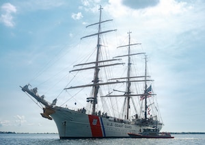 A boat sails across the Charleston Harbor.