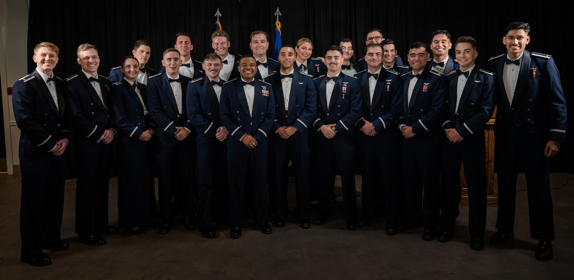 U.S. Air Force Airmen from graduating class 26-13 pose for a photo during their graduation ceremony at Laughlin Air Force Base, Texas, July 1, 2026. Twenty-two U.S. Air Force officers were awarded their silver wings during the ceremony, symbolizing their completion of the Undergraduate Pilot Training program. (U.S. Air Force photo by Airman 1st Class Harrison Sullivan)