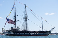 250704-N-UM082-1099 BOSTON (July 4, 2025) – USS Constitution sails in Boston Harbor in honor of Independence Day. USS Constitution is the world’s oldest commissioned warship afloat and serves as America’s Ship of State. She played a crucial role in the Barbary Wars and the War of 1812, actively defending sea lanes from 1797 to 1855. During normal operations, the active-duty Sailors stationed aboard USS Constitution provide free tours and welcome more than 600,000 visitors annually, supporting the ship’s mission of promoting the Navy’s history and maritime heritage, and raising awareness of the importance of a sustained naval presence. USS Constitution was undefeated in battle, having destroyed or captured 33 enemy vessels. She earned the nickname Old Ironsides during the War of 1812, when British cannonballs were seen bouncing off her wooden hull. (U.S. Navy photo by Mass Communication Specialist 1st Class Raymond Minami/Released)