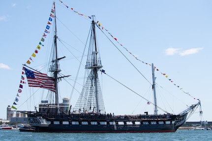 250704-N-UM082-1099 BOSTON (July 4, 2025) – USS Constitution sails in Boston Harbor in honor of Independence Day. USS Constitution is the world’s oldest commissioned warship afloat and serves as America’s Ship of State. She played a crucial role in the Barbary Wars and the War of 1812, actively defending sea lanes from 1797 to 1855. During normal operations, the active-duty Sailors stationed aboard USS Constitution provide free tours and welcome more than 600,000 visitors annually, supporting the ship’s mission of promoting the Navy’s history and maritime heritage, and raising awareness of the importance of a sustained naval presence. USS Constitution was undefeated in battle, having destroyed or captured 33 enemy vessels. She earned the nickname Old Ironsides during the War of 1812, when British cannonballs were seen bouncing off her wooden hull. (U.S. Navy photo by Mass Communication Specialist 1st Class Raymond Minami/Released)