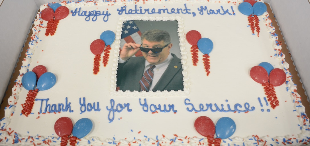 A decorated cake is pictured of retiree, Mark Brewer.