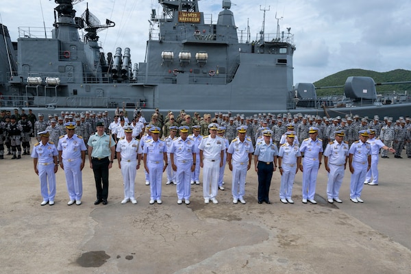 Heads of delegation representing the United States, Thailand, and Canada pose for a photo during the opening ceremony of exercise Cooperation Afloat Readiness and Training (CARAT) Thailand 2026, July 6, 2026, at Laem Tian Pier.