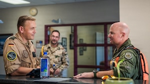 U.S. Air Force Brig. Gen. David Berkland, 56th Fighter Wing commander, right, and German Air Force Lt. Col. Tom Doberschuetz, 3rd German Air Force Training Squadron commander, speak before a flight during a leadership engagement at Luke Air Force Base, Arizona, July 1, 2026.