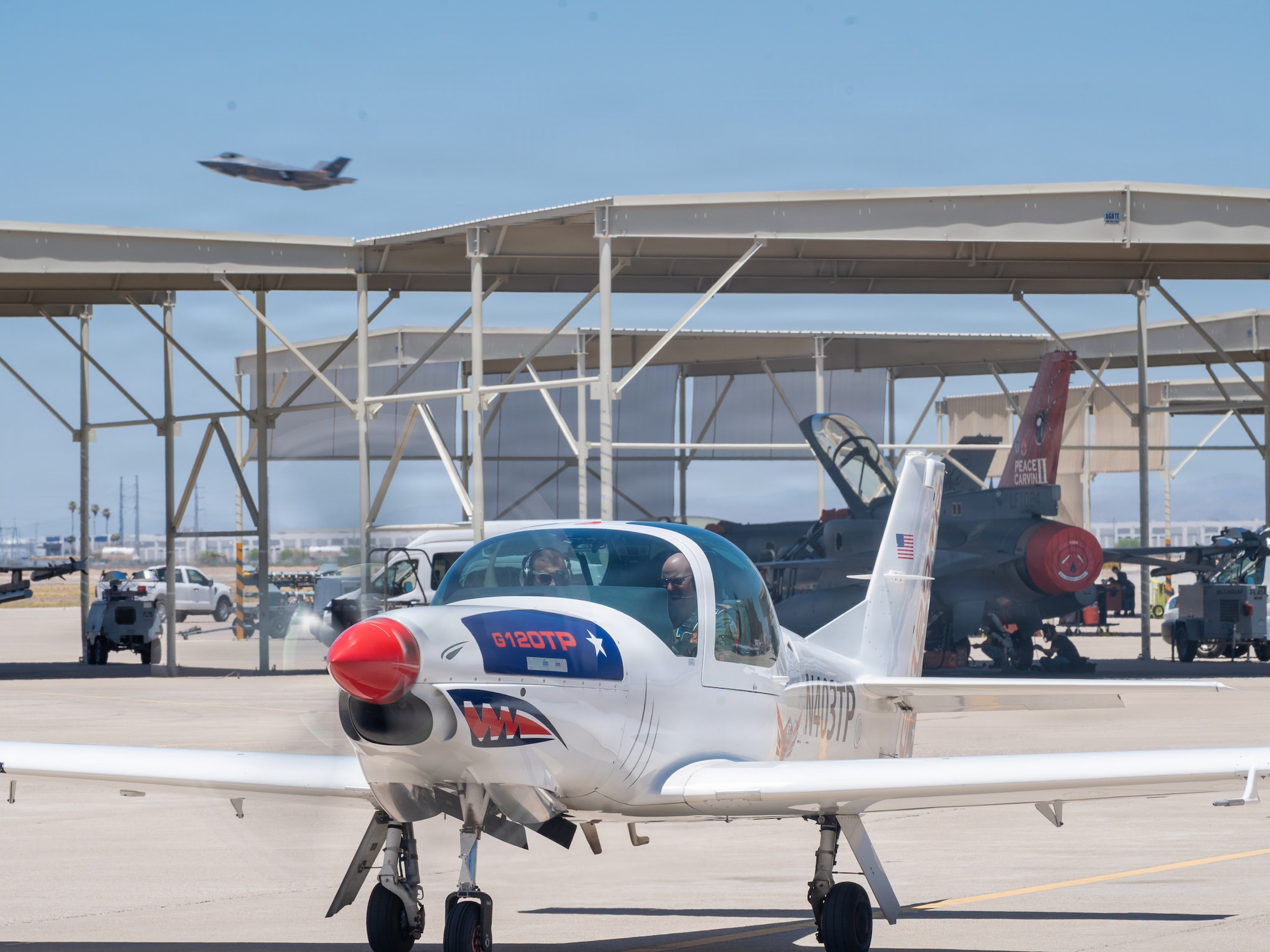 U.S. Air Force Brig. Gen. David Berkland, 56th Fighter Wing commander, right, and German Air Force Lt. Col. Tom Doberschuetz, 3rd German Air Force Training Squadron commander, prepare for takeoff in a Grob 120TP trainer aircraft as part of a leadership engagement at Luke Air Force Base, Arizona, July 1, 2026.