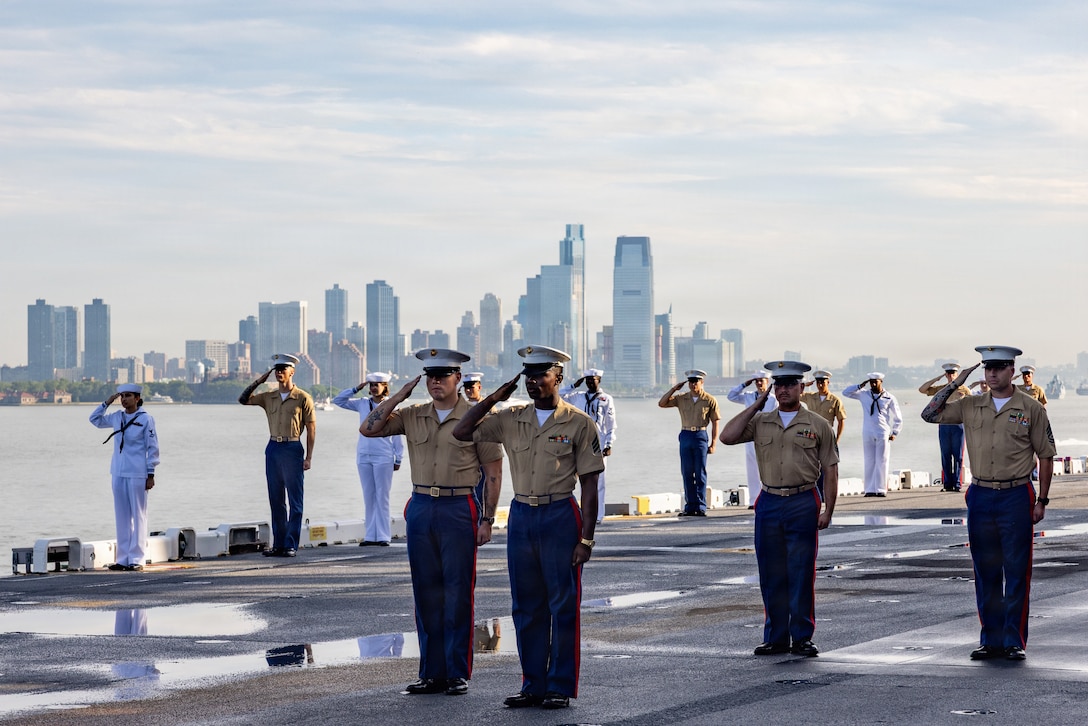 U.S. Marines and Sailors with the Special Purpose Marine-Air Ground Task Force Sail 250, render honors for colors as part of International Naval Review 250 in Manhattan, July 4, 2026.  For 250 years, the U.S Navy and Marine Corps stood the watch – constant, unabated in mission, faithfully preventing crisis and resolute in defending America’s independence. INR 250 honors the Navy, Marine Corps, and Coast Guard’s enduring role on, under, and above the seas.  (U.S. Marine Corps photo by Lance Cpl. Elijua Guel)