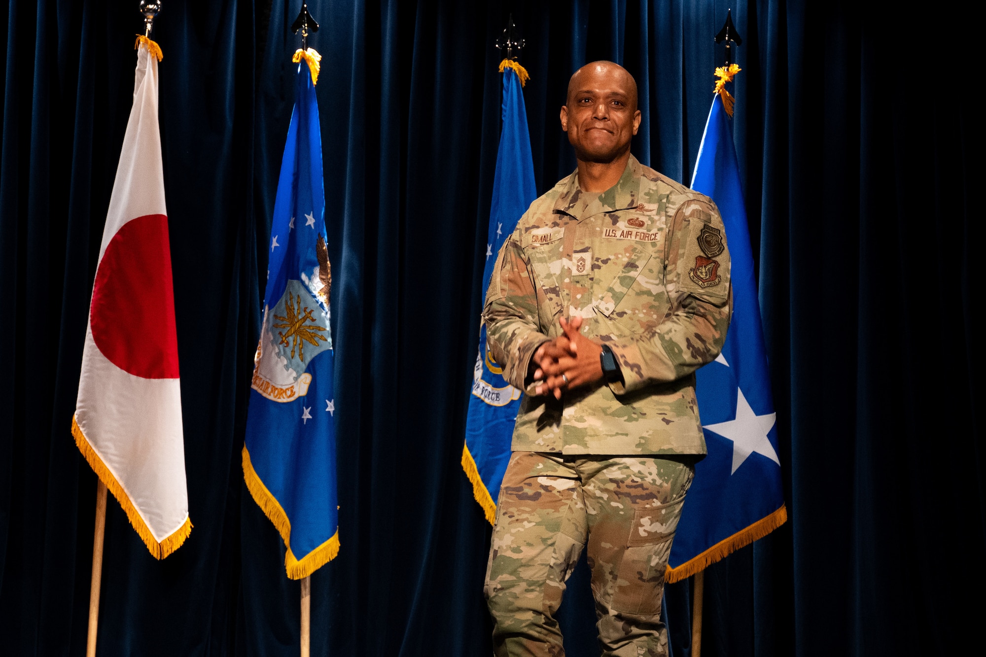 Chief Master Sergeant Andrew Small gives remarks after assumed responsibility as the command chief for 5th Air Force during an assumption of responsibility ceremony at the Yokota Enlisted Club on on July 7, 2026.