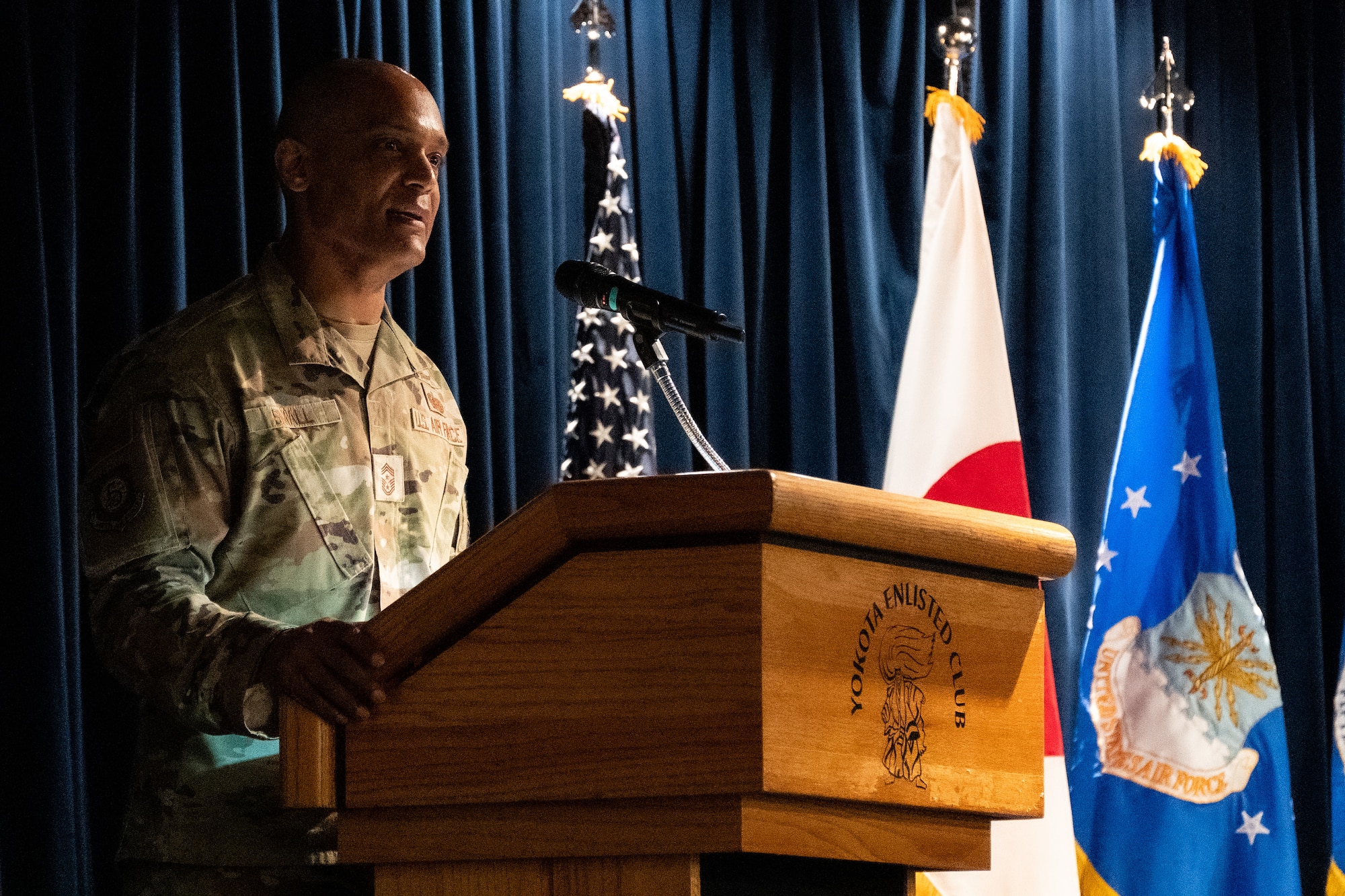 Chief Master Sergeant Andrew Small gives remarks after assumed responsibility as the command chief for 5th Air Force during an assumption of responsibility ceremony at the Yokota Enlisted Club on on July 7, 2026.