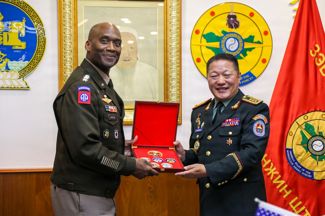 Mongolian Lt. Gen. Sunrev Ganbyamba presents a gift to U.S. Army Gen. Xavier T. Brunson during a bilateral meeting in Ulaanbaatar, Mongolia.