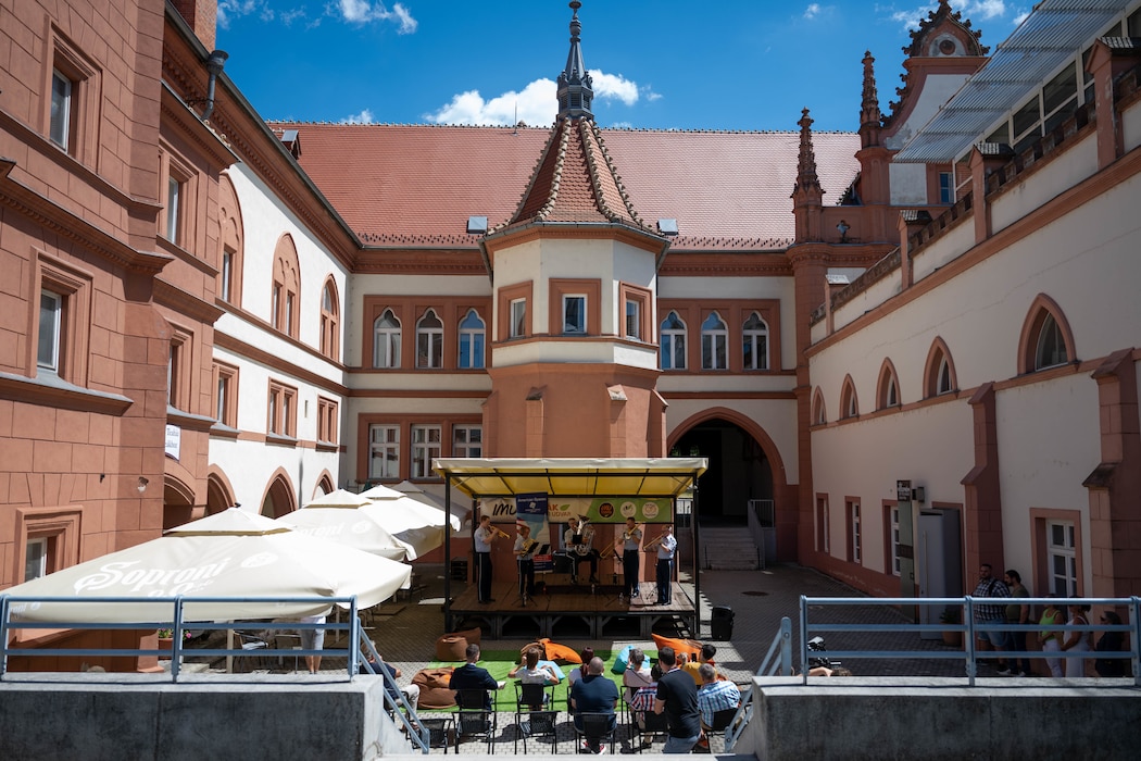The Unites States Air Forces in Europe and Air Forces Africa, Five Star Brass Band plays music for a local crowd, as part of an event commemorating America's 250th anniversary in Veszprém, Hungary, July 4, 2026.