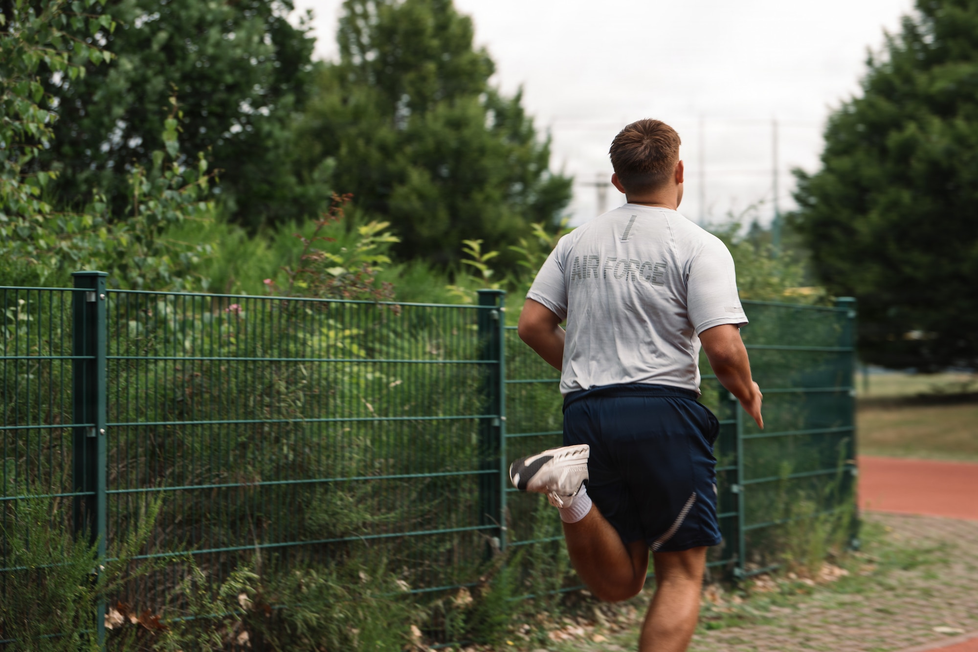 U.S. Air Force Airman 1st Class Baldemar Campos, 86th Maintenance Operations maintenance scheduler, runs on the Southside Fitness Center track at Ramstein Air Base, Germany, June 11, 2026.