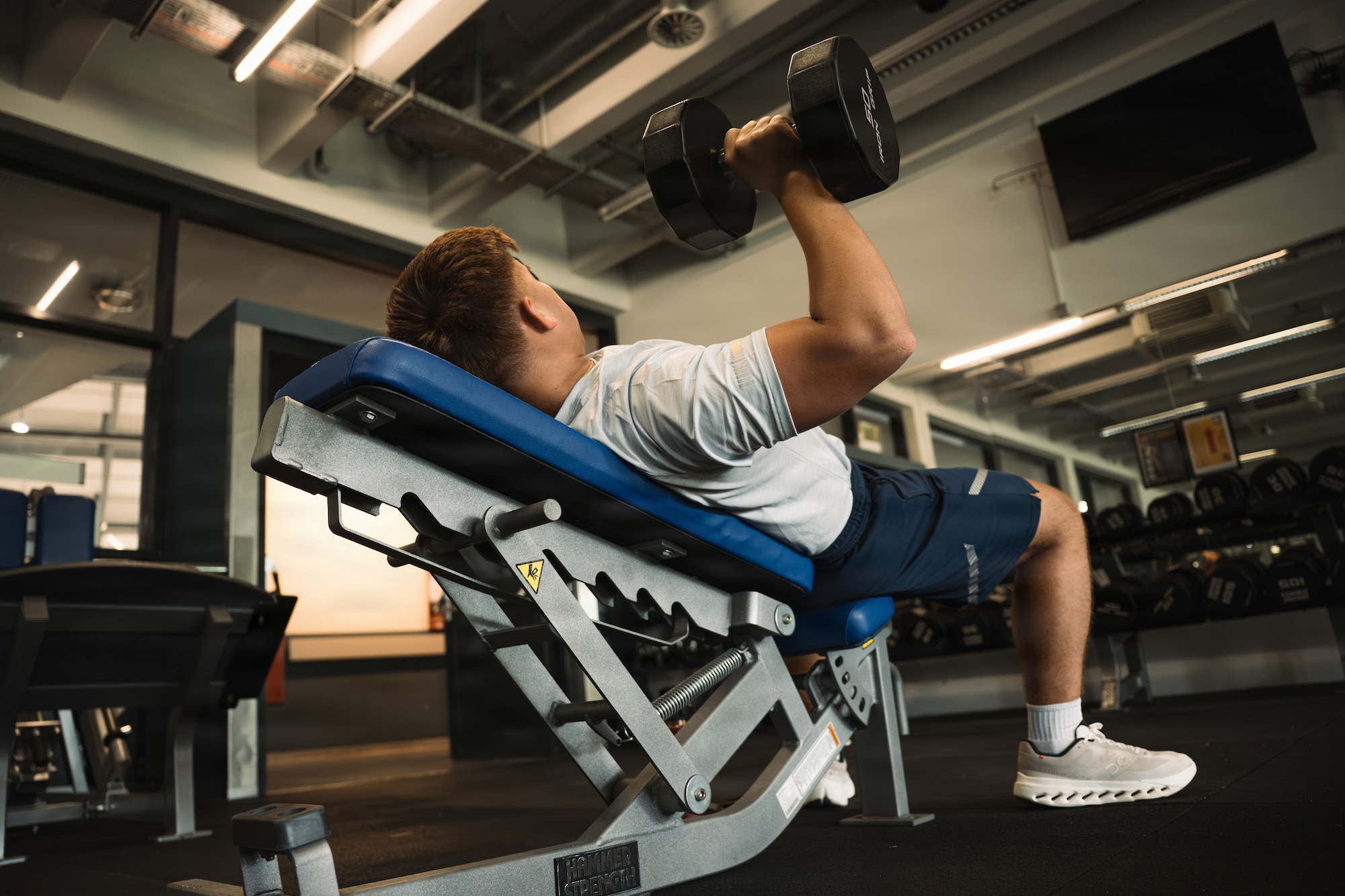 U.S. Air Force Airman 1st Class Baldemar Campos, 86th Maintenance Operations maintenance scheduler, performs an incline dumbbell bench press at the Southside Fitness Center at Ramstein Air Base, Germany, June 11, 2026.