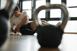 U.S. Air Force Airman 1st Class Baldemar Campos, 86th Maintenance Operations maintenance scheduler, performs an abdominal exercise to strengthen his core muscles inside the Southside Fitness Center at Ramstein Air Base, Germany, June 11, 2026.