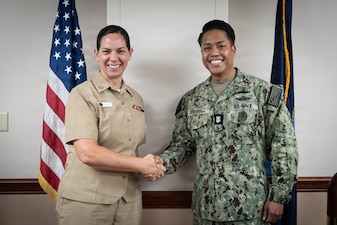 Navy Lt. Joelle Borja receives a coin from Navy Force Master Chief PatrickPaul “PaP” C. Mangaran, command senior enlisted leader for the Defense Health Agency, in recognition of her exceptional service aboard Marine Corps Air Station Cherry Point as the Installation Mental Health Coordinator. Mangaran toured Naval Health Clinic Cherry Point for an update on latest development to facilities for patients and staff. NHCCP serves as the keystone of medical readiness for units assigned to Marine Corps Air Station Cherry Point.
