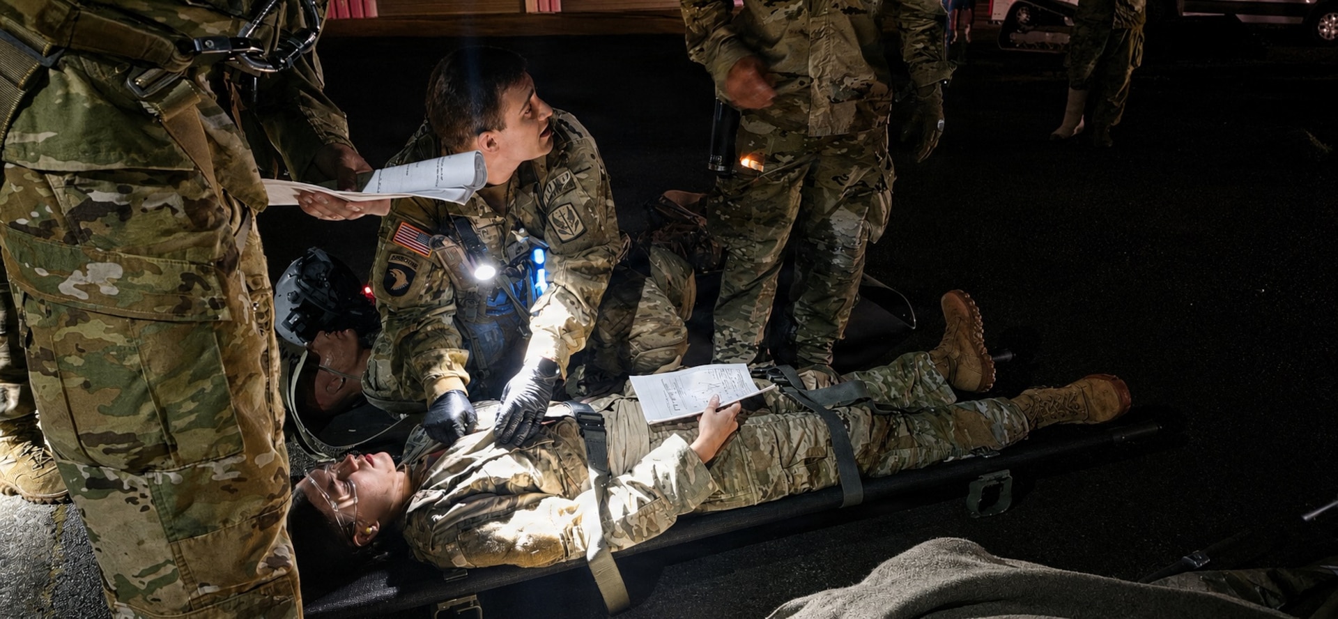 Staff Sgt. Noel Mueller, assigned to Detachment 2, Charlie Company, 1st Battalion, 126th Aviation Regiment, evaluates and prepares a simulated casualty for transfer during a mass casualty exercise at Camp Dawson, West Virginia, June 11, 2026.