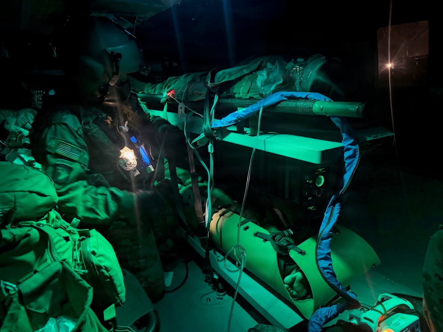 Sgt. Hunter Allen, assigned to Detachment 2, Charlie Company, 1st Battalion, 126th Aviation Regiment, provides in-flight care to a simulated casualty during a mass casualty exercise at Camp Dawson, West Virginia, June 11, 2026.