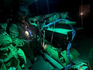 Sgt. Hunter Allen, assigned to Detachment 2, Charlie Company, 1st Battalion, 126th Aviation Regiment, provides in-flight care to a simulated casualty during a mass casualty exercise at Camp Dawson, West Virginia, June 11, 2026.