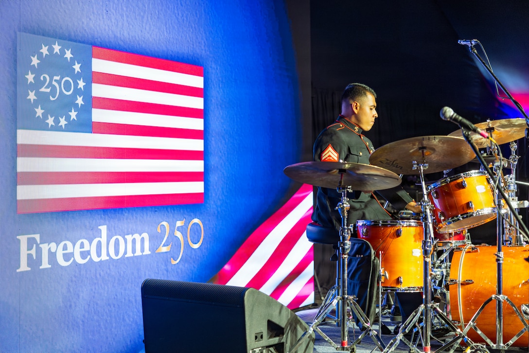 U.S. Marine Corps Cpl. Cristian Granados, a percussionist with Marine Forces Reserve Band, prepares his drum kit before a jazz ensemble performance during the U.S. Embassy Buenos Aires Independence Day celebration in Buenos Aires, Argentina, June 30, 2026. The annual event commemorates the 250th anniversary of the United States' independence and provides an opportunity to strengthen ties between U.S. and Argentine government, military, and civilian partners. (U.S. Marine Corps photo by Sgt. Samuel Qin)