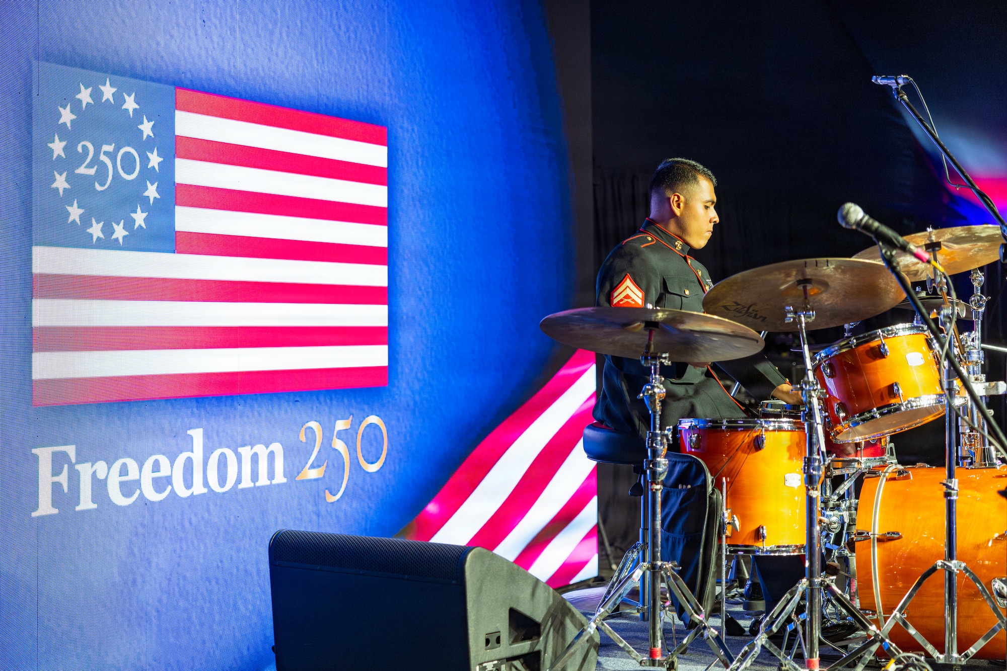 U.S. Marine Corps Cpl. Cristian Granados, a percussionist with Marine Forces Reserve Band, prepares his drum kit before a jazz ensemble performance during the U.S. Embassy Buenos Aires Independence Day celebration in Buenos Aires, Argentina, June 30, 2026. The annual event commemorates the 250th anniversary of the United States' independence and provides an opportunity to strengthen ties between U.S. and Argentine government, military, and civilian partners. (U.S. Marine Corps photo by Sgt. Samuel Qin)