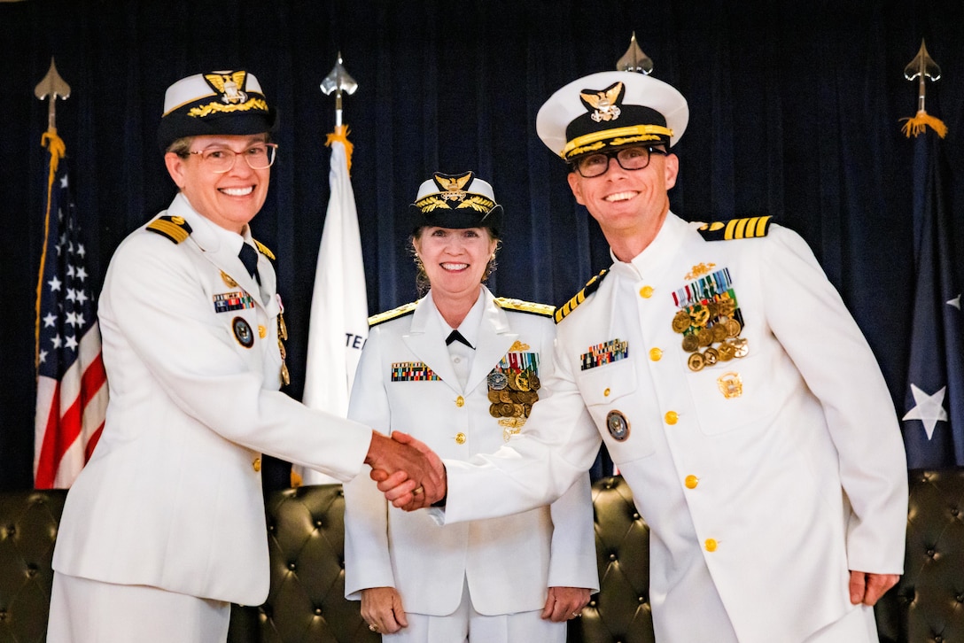 (Left to right) U.S. Coast Guard Capt. Jennifer T. Loth, outgoing commanding officer, Coast Guard Reserve Unit United States Northern Command; Rear Adm. Tiffany Danko, assistant commandant for Workforce Management; and Capt. Ian G. Brosnan, incoming commanding officer, stand together during the CGRU USNORTHCOM change of command ceremony at Peterson Space Force Base, June 12, 2026. During the ceremony, Loth transferred command to Brosnan. (Courtesy photo by Jhomil Bansil)