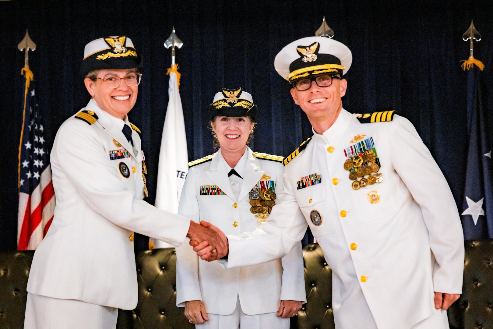 (Left to right) U.S. Coast Guard Capt. Jennifer T. Loth, outgoing commanding officer, Coast Guard Reserve Unit United States Northern Command; Rear Adm. Tiffany Danko, assistant commandant for Workforce Management; and Capt. Ian G. Brosnan, incoming commanding officer, stand together during the CGRU USNORTHCOM change of command ceremony at Peterson Space Force Base, June 12, 2026. During the ceremony, Loth transferred command to Brosnan. (Courtesy photo by Jhomil Bansil)