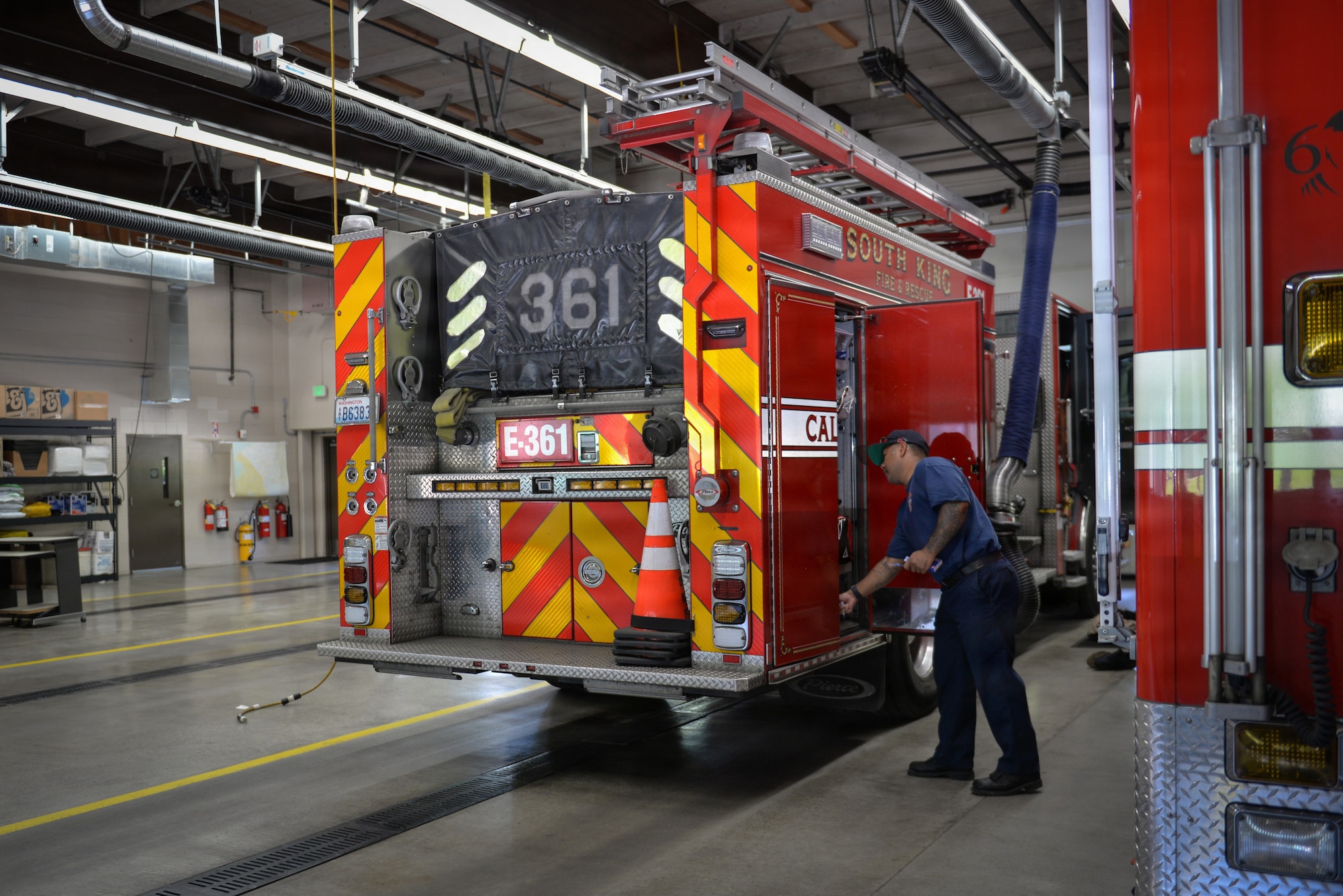 Firefighter conducts safety check on truck