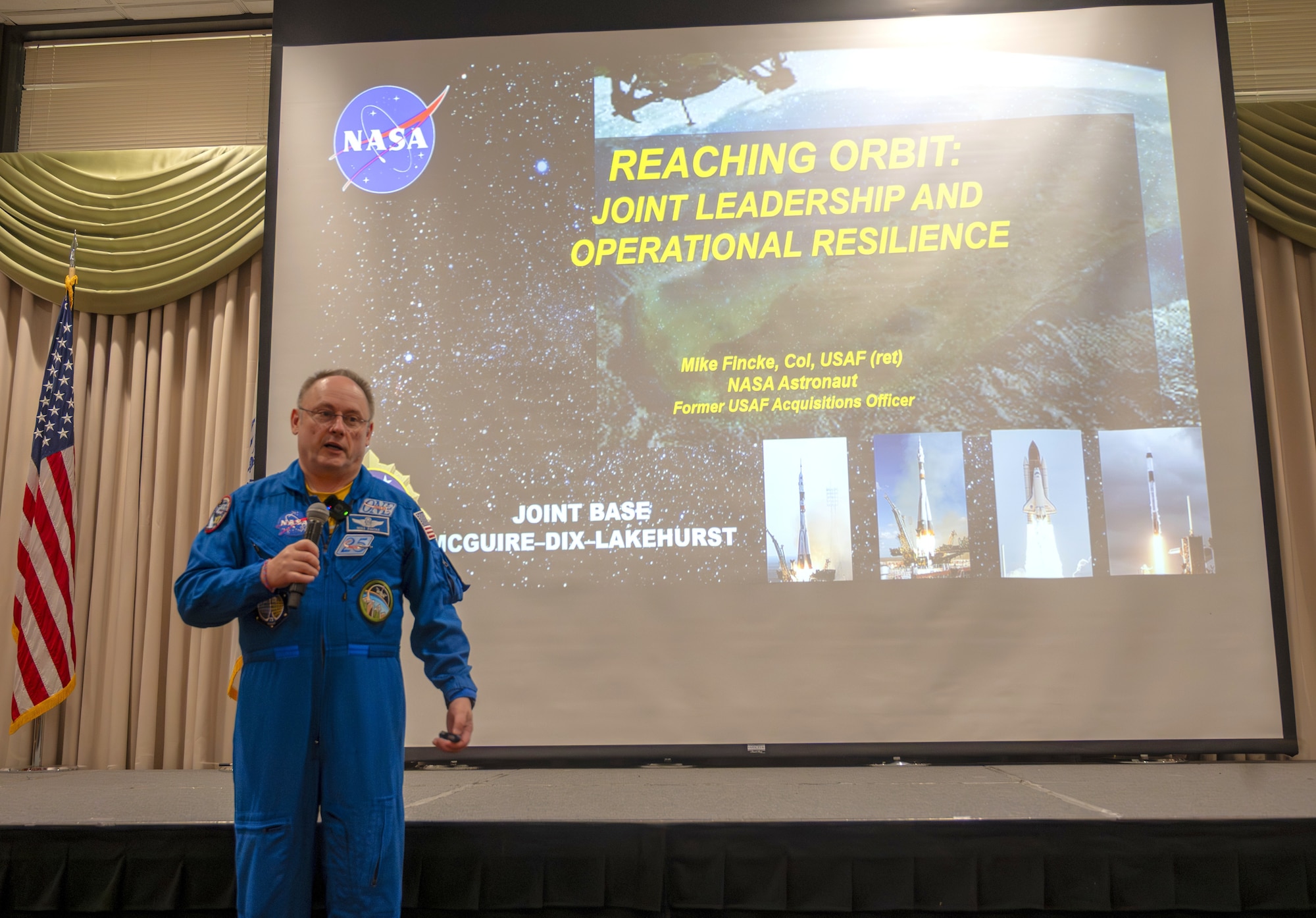 Retired U.S. Air Force Col. and NASA astronaut Michael Fincke speaks to Joint Base McGuire-Dix-Lakehurst personnel at JB MDL, N.J., June 22, 2026. Fincke, who joined the NASA astronaut corps in 1996 and has accumulated 549 days in space, brought his decades of military and spaceflight experience to the installation, speaking to both joint base personnel and their children during his visit. (U.S. Air Force photo by Susan Moriarty)