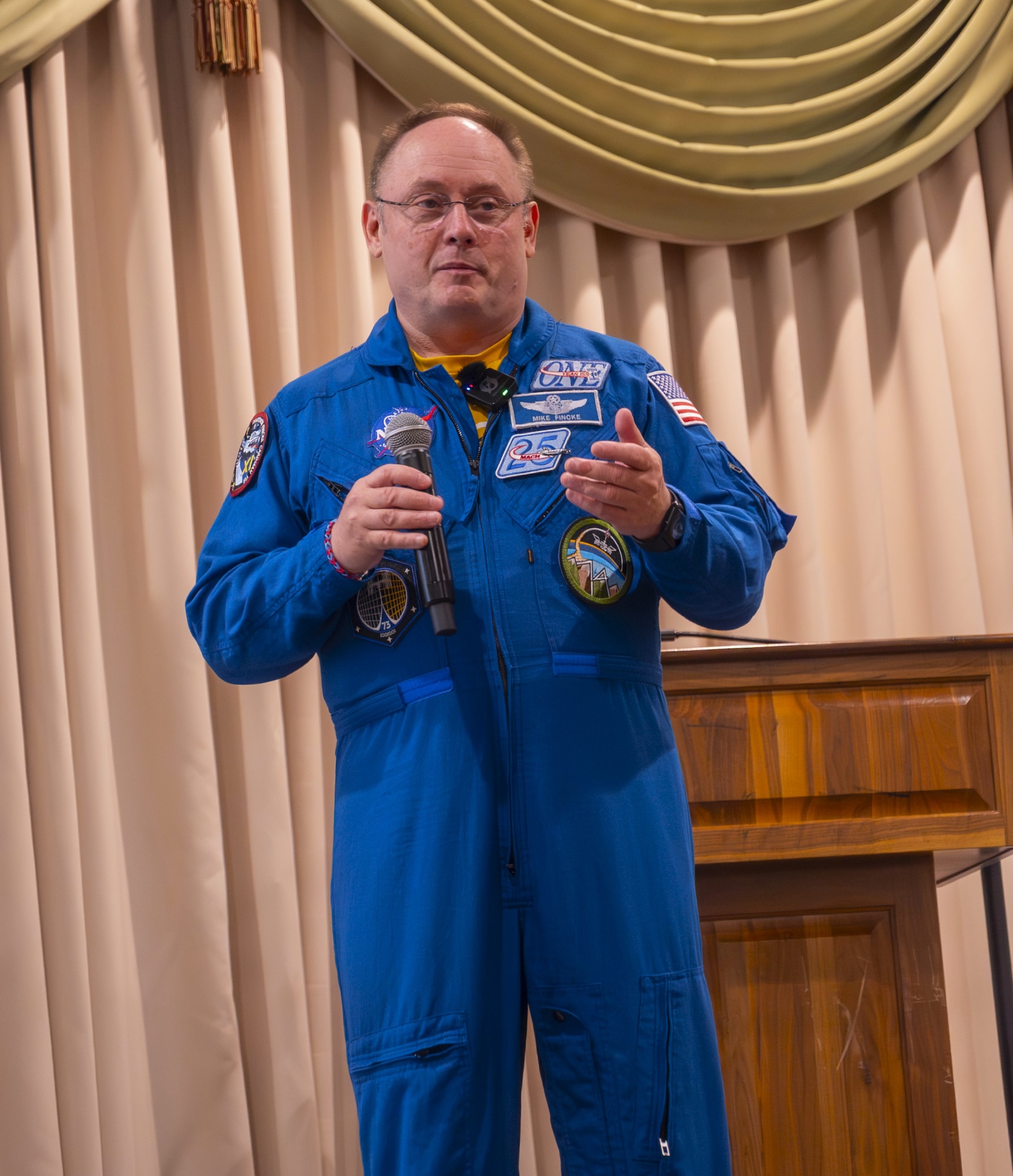Retired U.S. Air Force Col. and NASA astronaut Michael Fincke speaks to Joint Base McGuire-Dix-Lakehurst personnel at JB MDL, N.J., June 22, 2026. During his presentation, Fincke shared stories and videos about his most recent NASA Space X Crew-11 mission aboard the International Space Station as well as lessons learned during his decades of military and spaceflight experience. (U.S. Air Force photo by Susan Moriarty)