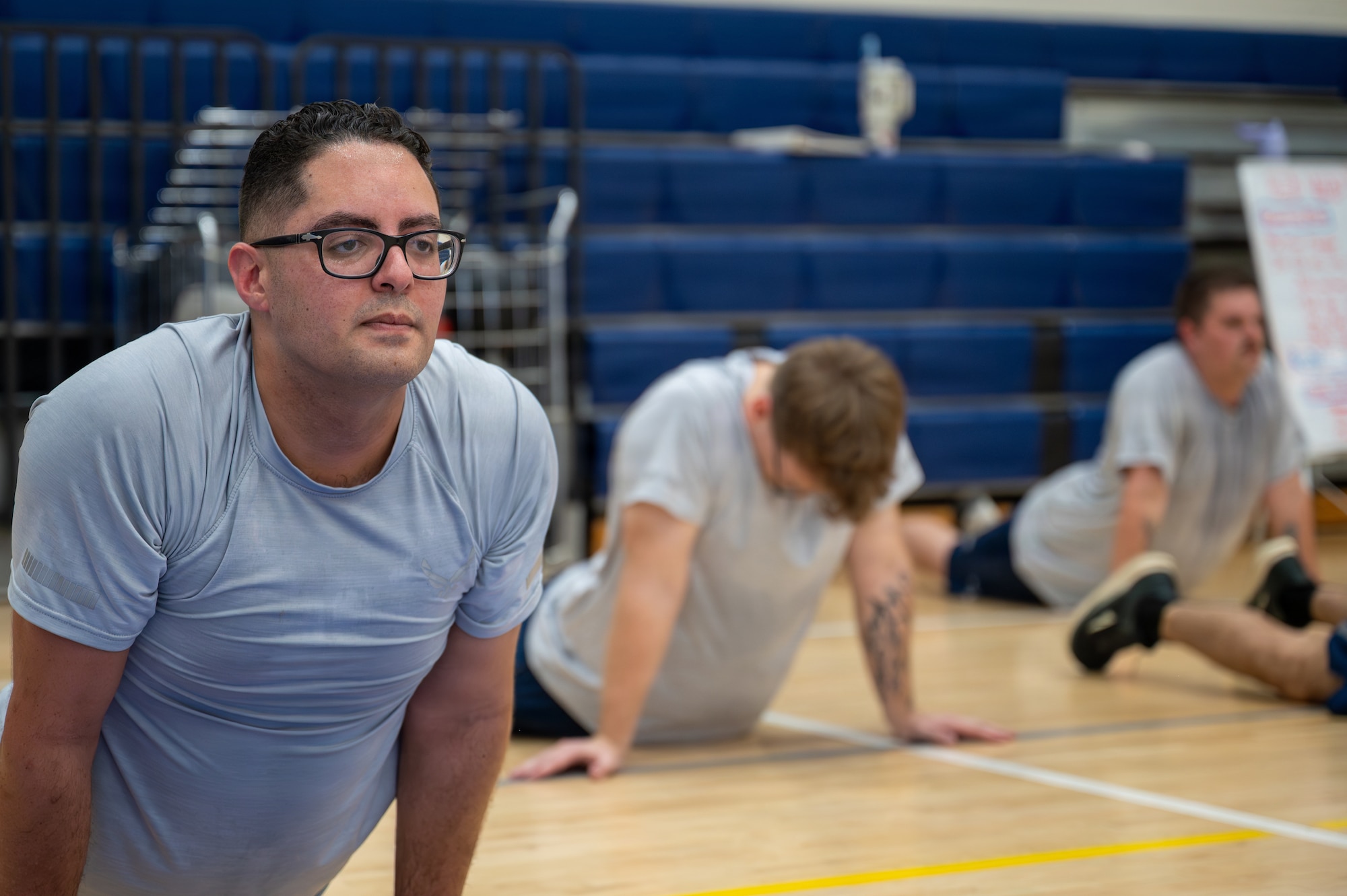 Airmen exercise together.