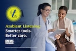 Provider wearing white coat and stethoscope shows clipboard to smiling patient.