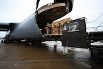 U.S. Air Force Staff Sgt. Ryan J. Clark, 68th Airlift Squadron loadmaster, offloads hazardous narcotics from a C-5M Super Galaxy at Wright-Patterson Air Force Base, Ohio, May 20th, 2026. The joint interagency mission, conducted alongside the Drug Enforcement Administration, marked the largest recorded aerial transport of hazardous narcotics for destruction through incineration. The operation highlighted the Air Force’s rapid global mobility capabilities in support of interagency counter-narcotics efforts. (U.S. Air Force photo by Senior Airman Joshua Fontenot)