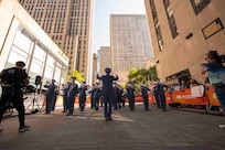 The Air Force Band plays with the New York City skyline behind them.