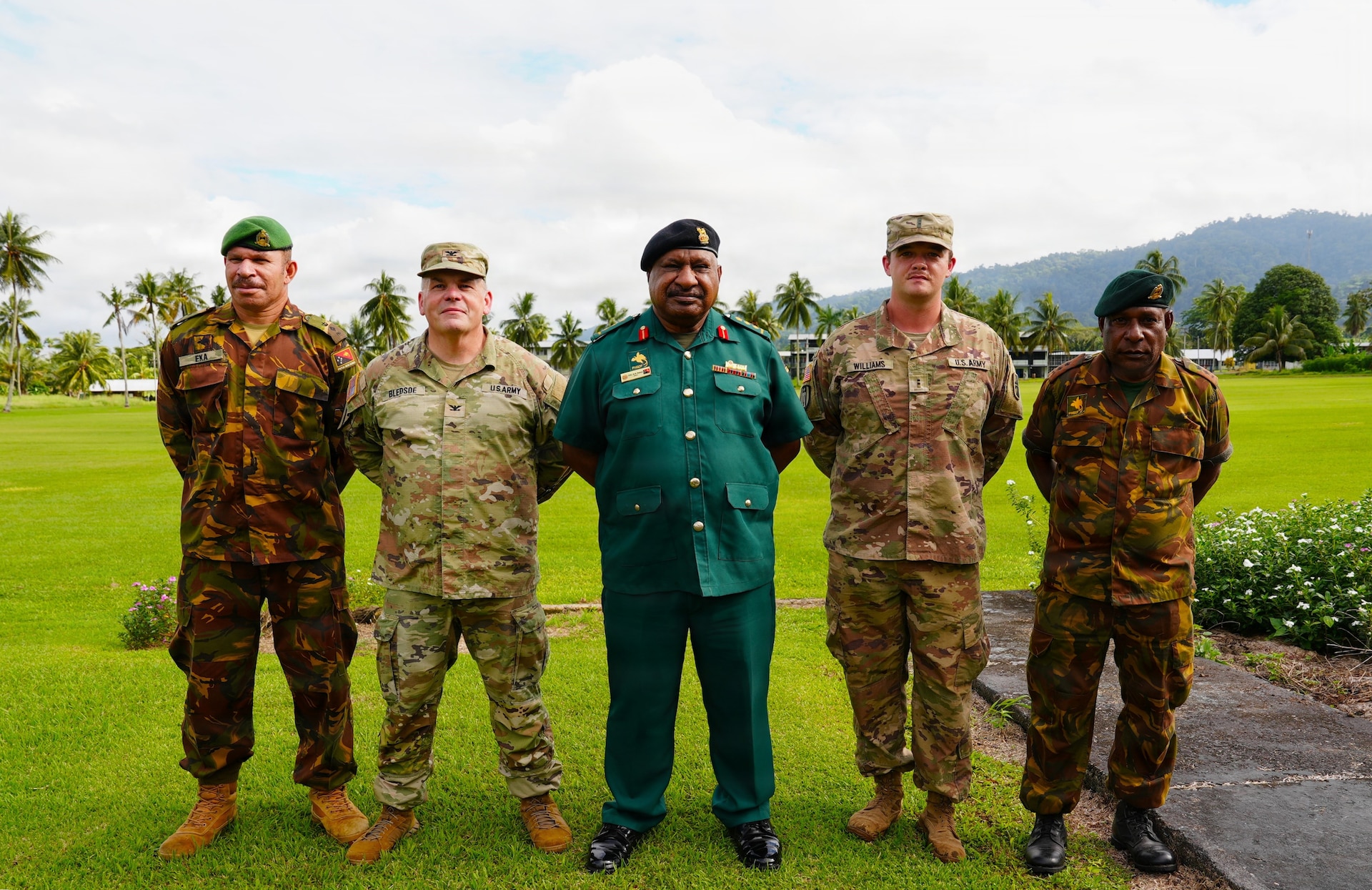 Papua New Guinea Defense Force’s Col. Michael Percy Marai, the commandant of Lae Area, U.S. Army Col. Jake Bledsoe, commander of the 4960th Multifunction Training Brigade, 9th Mission Support Command, and Chief Warrant Officer 2 Austin Williams from the 844th Engineer Battalion pose for a group photo during Exercise Tamiok Strike 26 at Igam Barracks, Lae, Papua New Guinea, July 7, 2026.
