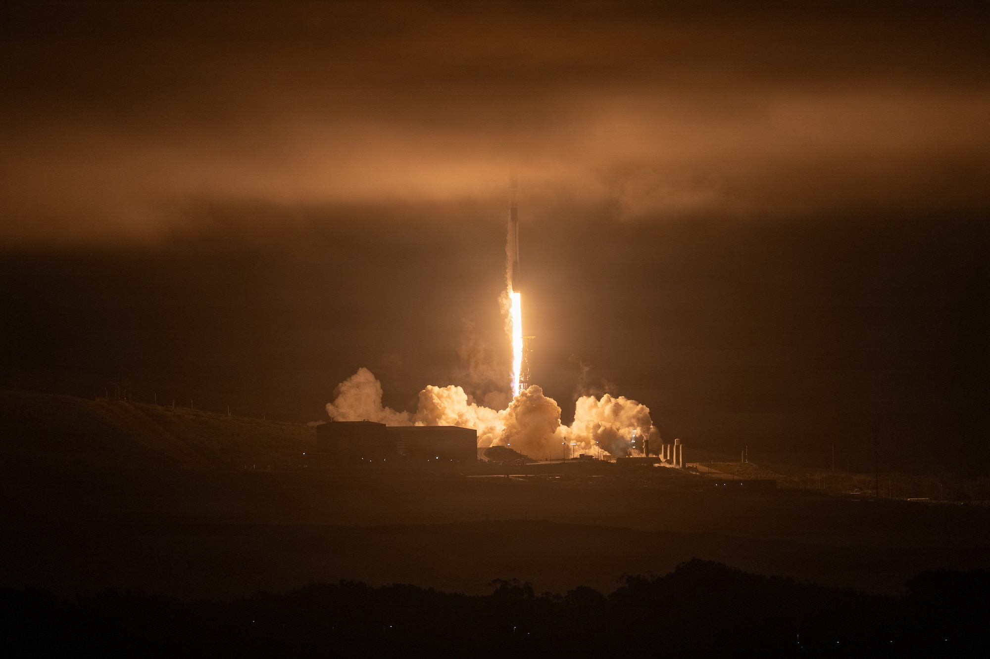 Rocket launches into marina layer.