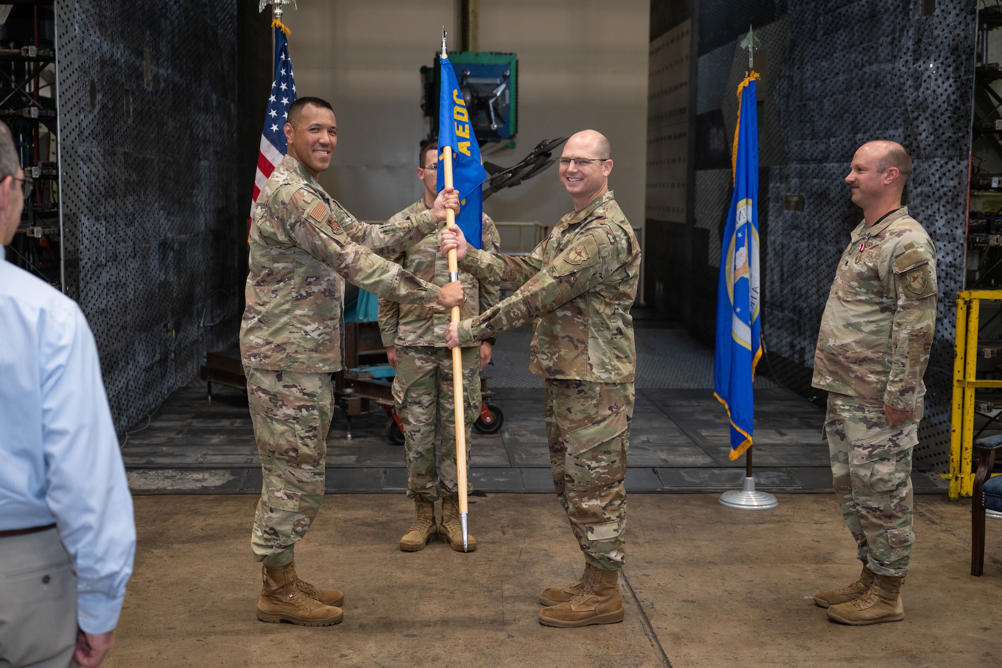 Lt. Col. Jason Thomas, center, takes the guidon from 804th Test Group Commander Col. Jack Rhodes, left, to assume command of the 716th Test Squadron during a June 10, 2026, Change of Command ceremony at Arnold Air Force Base, Tenn., headquarters of Arnold Engineering Development Complex. Also pictured is outgoing 716 TS commander Lt. Col. Joseph Sabat. (U.S. Air Force photo by Keith Thornburgh)