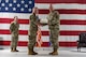 U.S. Air Force Col. James Slaton, 91st Security Forces Group (SFG) outgoing commander, right, receives the Legion of Merit certificate from U.S. Air Force Col. Jimmy Schlabach, 91st Missile Wing commander, during a change of command ceremony at Minot Air Force Base, North Dakota, July 1, 2026. As the 91st SFG commander, Slaton was primarily responsible for maintaining the security of the Minuteman III missile silos in the surrounding area.
