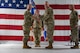 U.S. Air Force Col. Jimmy Schlabach, 91st Missile Wing commander, left, receives the guidon from U.S. Air Force Col. James Slaton, 91st Security Forces Group (SFG) commander, during a change of command ceremony at Minot Air Force Base, North Dakota, July 1, 2026. As the 91st SFG commander, Slaton was primarily responsible for maintaining the security of the Minuteman III missile silos in the surrounding area.