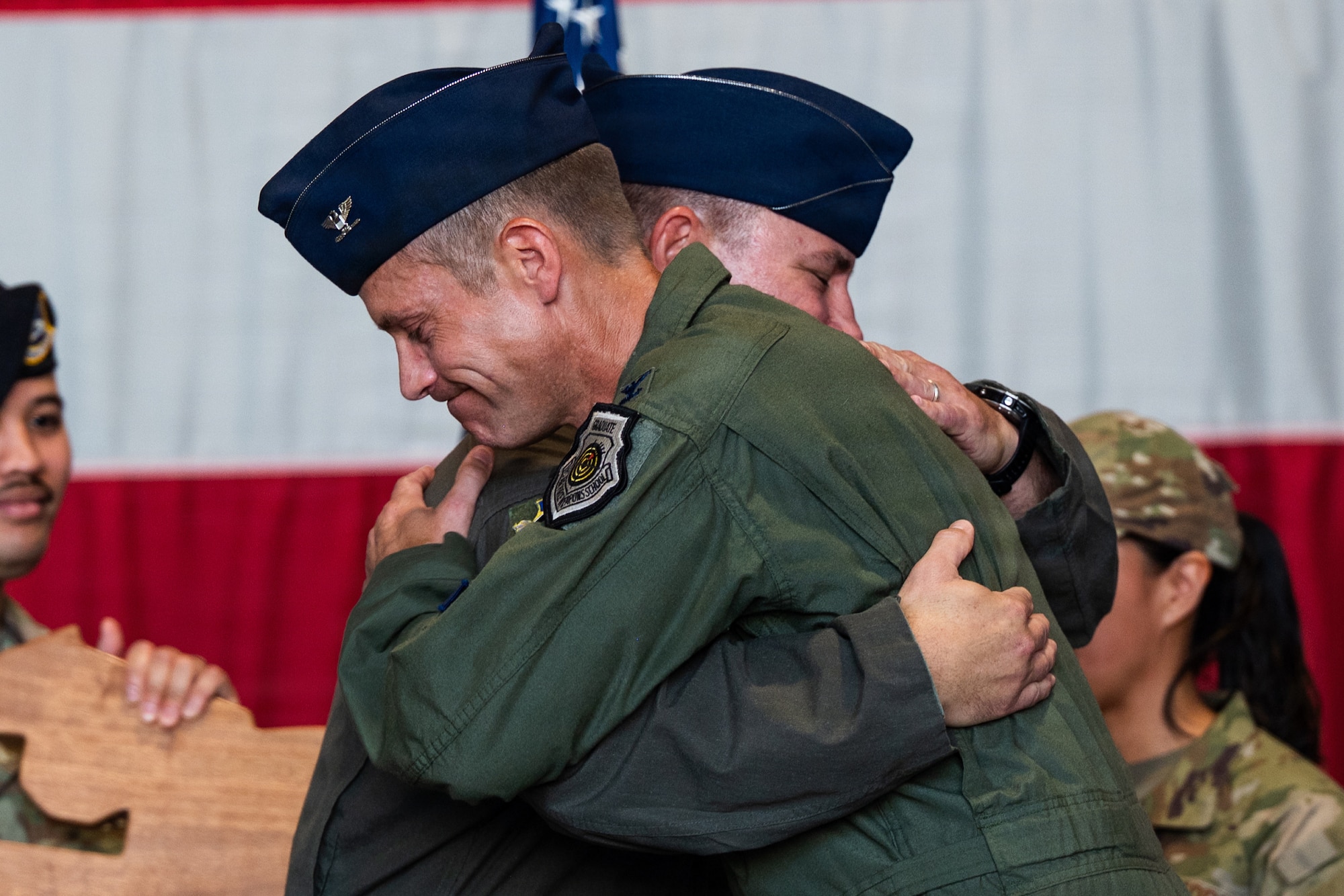 Two pilots hug each other