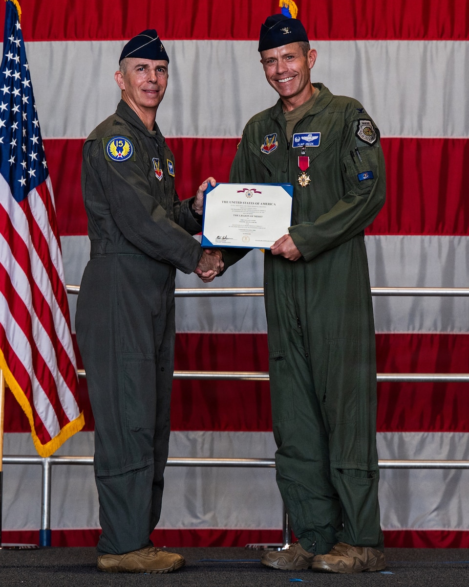 A general gives a pilot a certificate
