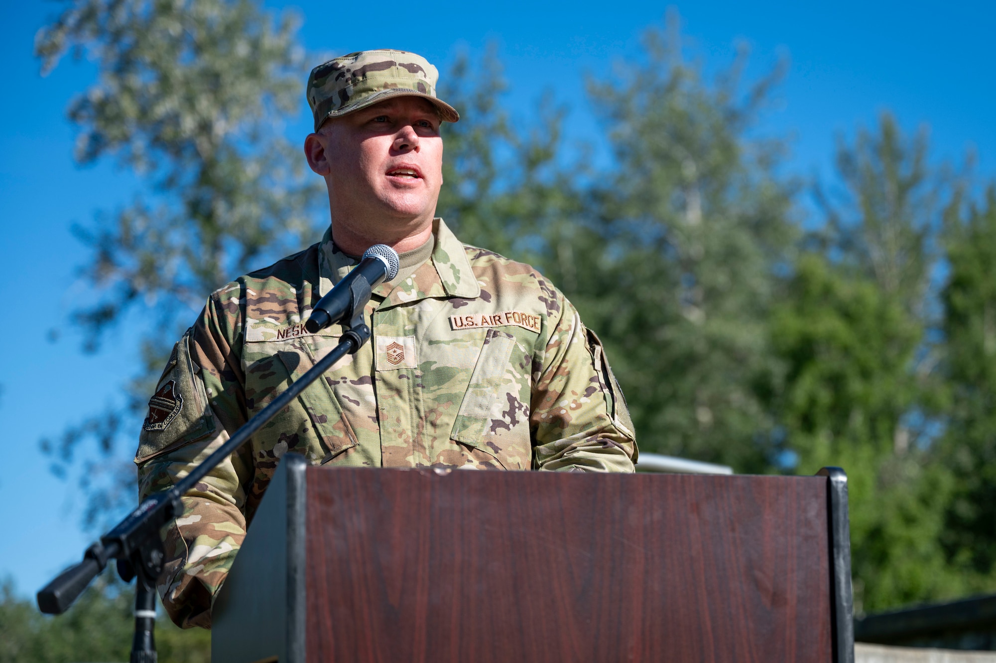 U.S. Air Force Chief Master Sgt. Ian Neske, 354th Fighter Wing command chief, gives a speech during an assumption of responsibility ceremony at Eielson Air Force Base, Alaska, July 2, 2026.