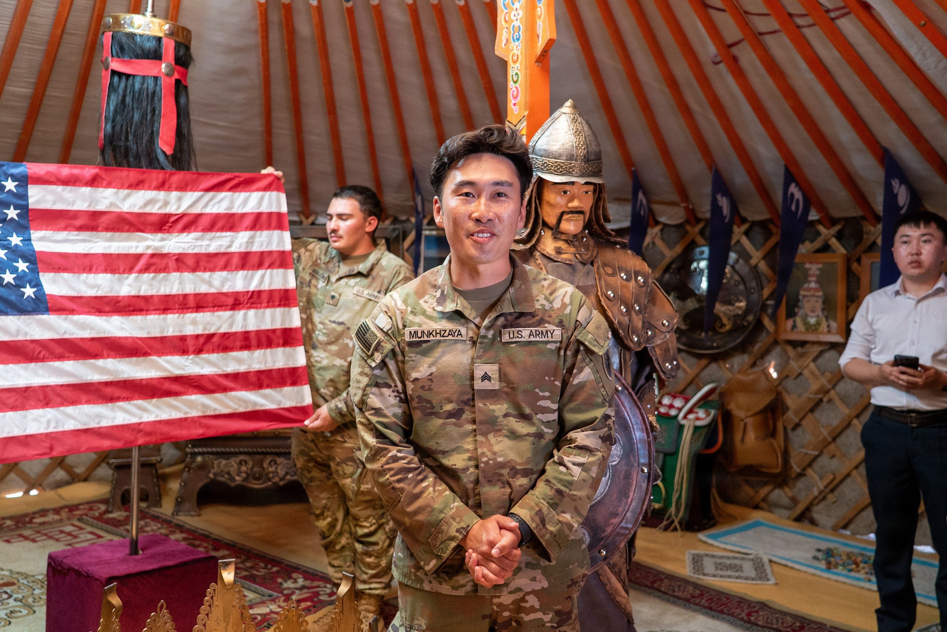 U.S. Army Sgt. Munk Munkhzaya, a finance technician assigned to the 125th Finance Battalion, 8th Theater Sustainment Command, speaks during his reenlistment ceremony inside a traditional Mongolian ger at Five Hills Training Area, Mongolia, July 2, 2026